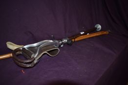 An adjustable height shooting stick with a baton type walking stick measuring 92cm long, and a