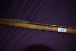 An antique 10ft 2pc split cane fly rod with spare tip, the tips being stored inside a bamboo pole