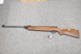 A Hatsan Edgar Brothers Mod 6.0 S .22 calibre Air rifle Quatro trigger Ser No 110301274 with a tin