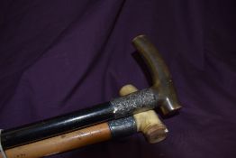 Two walking canes both having ornate white metal ferules which are heavily rubbed 83 and 85cm