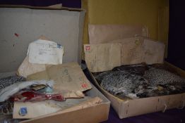 Two vintage cardboard boxes containing birds wings of various colours and sizes for fly tying