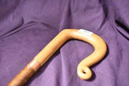 A shepherds crook walking stick the crook is carved from piece of wood and the shaft is hazel