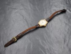 A lady's vintage 9ct gold wrist watch by Trebex having an Arabic numeral and baton dial with
