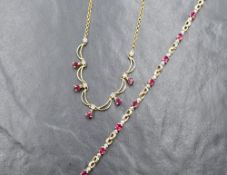 A 14ct gold ruby and diamond set necklace, the illusion set diamond chips, interspersed with gold