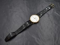 A gents 9ct gold quartz wrist watch by Evereite having a baton numeral date with date aperture on