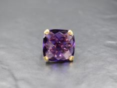 An 18ct gold amethyst set statement ring, the square rose cut amethyst measuring approximately