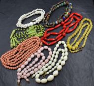Eight vintage strings of beads including marble effect, glass and ceramic etc
