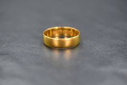 A 22ct gold wedding band of plain form, size K/L & 2.4g
