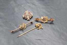 A group of three gold and yellow metal brooches, comprising an 8ct gold Jerusalem brooch marked 333,
