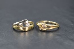 A 14ct two tone diamond set ring, the round brilliant cut diamond, measuring approximately 0.15ct,