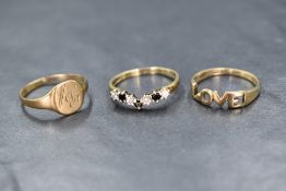 A 9ct gold cubic zirconia set wishbone ring, the alternating blue and clear round cut cubic zirconia