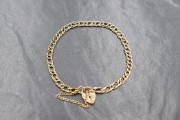 A 9ct gold double curb link bracelet with padlock clasp, approx 5.8g
