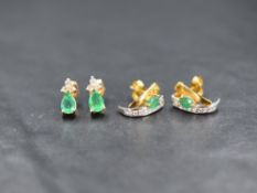 A pair of 14ct gold emerald and diamond set stud earrings, the trio of round brilliant cut