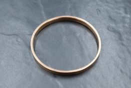 A Victorian 9ct rose gold hollow continuous bangle of plain form, inner diameter: 75mm & 10.1g