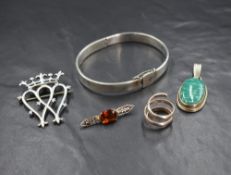 A Scottish silver Luckenbooth brooch, having two intertwined crowned hearts, along with a silver