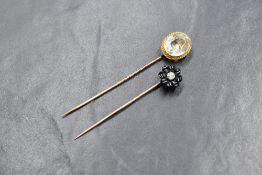 A yellow metal stick pin having jet and diamond floral terminal, no marks, and another yellow