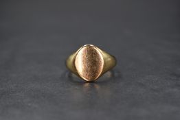 A 9ct gold signet ring, having an oval panel, marked 375, ring size R, 4.6g