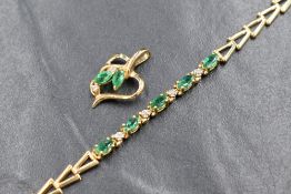A 14ct gold emerald and diamond set bracelet, the five marquise cut emeralds interspersed with