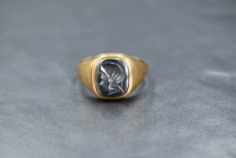 A gent's 9ct gold signet ring having a hematite panel depicting a Grecian soldier, size Y &5.2g