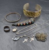 A small selection of white metal and silver jewellery including a Celtic Hound cuff bangle,