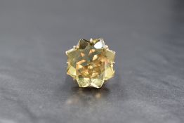 A 9ct gold citrine set statement ring, the star motif lemon tone citrine measuring approximately