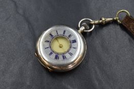 A small Victorian Swiss silver top wound Half Hunter pocket watch having a Roman numeral dial to