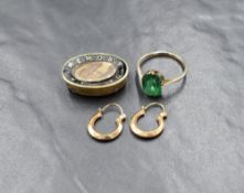 A 9ct gold green paste set ring, the emerald cut green paste in a four claw setting, marked 9ct,