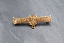 A 9ct gold medal bar brooch, having 'Furness Abbey No 102' engraved and personalised engraving to