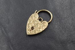 A 9ct gold heart padlock clasp, having decorative scroll engraving to the front, marked 375, 3.6g