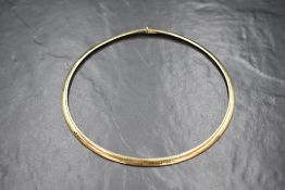 A 14ct gold snake link choker necklace, marked 14K, 13.5cm diameter, 36.2g