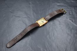 An 18ct gold case Novalis wristwatch, the rectangular dial having Arabic numerals in an 18ct gold