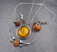 Five pieces of Baltic Amber & silver jewellery including an intaglio pendant of a maiden in profile,