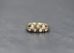 A 9ct gold emerald and cubic zirconia set band, having two rows of alternating round cut emeralds