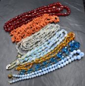 A selection of vintage beads including branch coral, long string of red crystal, clear crystal etc