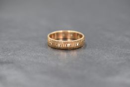 A 9ct gold cubic zirconia set eternity band, the band having round cut cubic zirconia with