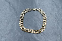 A 14ct gold fancy curb link bracelet, having a lobster clasp, marked 14k, 17cm, 4g. Clasp is