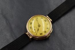 An early 20th century lady's 9ct rose gold wrist watch having a Roman numeral dial with subsidiary