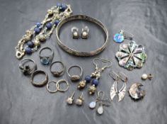 An assortment of silver and white metal jewellery, including a filigree bracelet, rings, a Victorian
