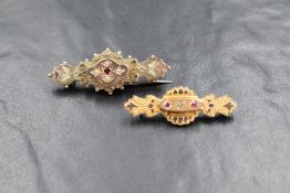 Two 9ct gold bar brooches having seed pearl and spinnel decoration and glass lockets en verso,
