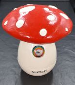 A new in box Swatch Gnomania wristwatch, having a rainbow dial with a gnome and flag as hands, in