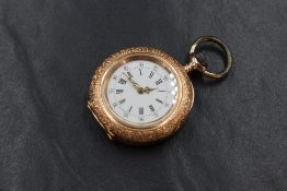A small continental gold pocket watch stamped 14K having a Roman numeral dial with peripheral minute