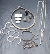 An assortment of silver and white metal jewellery, including a mother-of-pearl set pendant, four