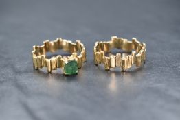 A contemporary yellow metal presumed gold emerald set wedding set, one band having a square cut