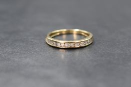 A 9ct gold diamond set half eternity ring having twenty small brilliant cut and baguette cut
