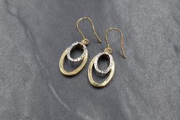 A pair of 9ct white & yellow gold loop drop earrings having double oval loop decoration, approx 2.