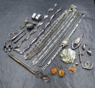 An assortment of silver jewellery, including a silver marcasite set cocktail watch, neck chains,