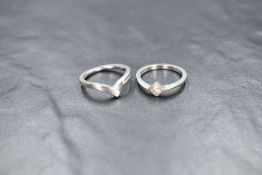 A platinum wedding set, comprising a diamond set solitaire and band, the princess cut diamond