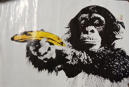 A Banksy ' monkey with banana ' poster measuring 62cm x 85cm - shows some wear - creasing
