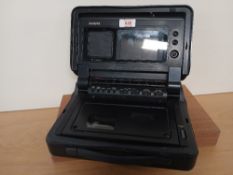 A Philips ' Moving Video ' portable VHS player with mini screen , a modern / retro collectable -