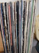 A large lot of vinyl albums - 42 in total - classic rock , pop and more - sleeves on the worn side